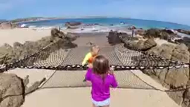 CABO BAJA CALIFORNIA SUR MEXICO-2019: Children Playing On Beach Safety Net