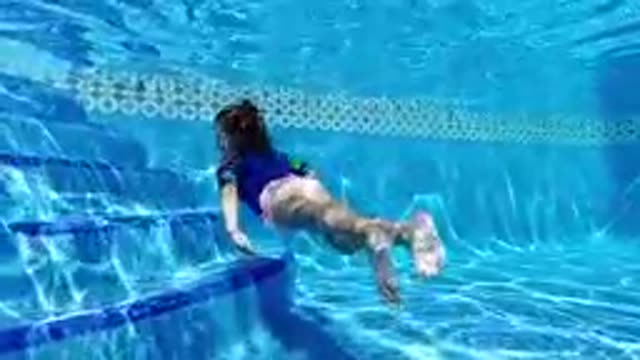 CABO BAJA CALIFORNIA SUR MEXICO-2019: Young Girl Swimming Underwater In Pool