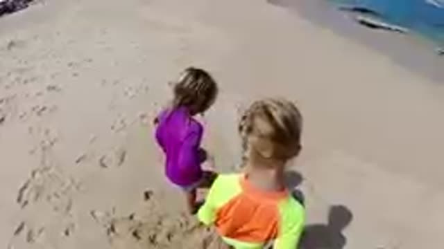 CABO BAJA CALIFORNIA SUR MEXICO-2019: Two Children Playing In Sand On Beach