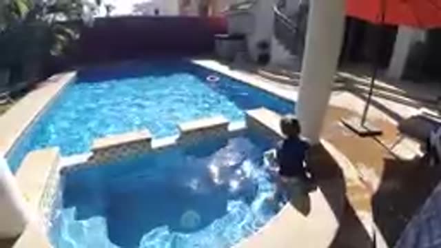 CABO BAJA CALIFORNIA SUR MEXICO-2019: Toddler Splashing In Residential Swimming Pool
