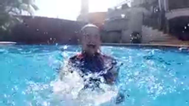 CABO BAJA CALIFORNIA SUR MEXICO-2019: Young Boy Swimming Freestyle In Backyard Pool