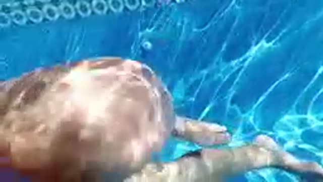 CABO BAJA CALIFORNIA SUR MEXICO-2019: Underwater View Of Legs Swimming In Pool
