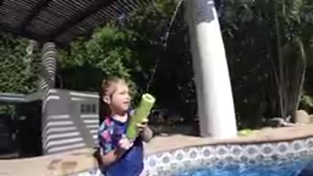 CABO BAJA CALIFORNIA SUR MEXICO-2019: Young Boy Playing With Pool Noodle By Pool