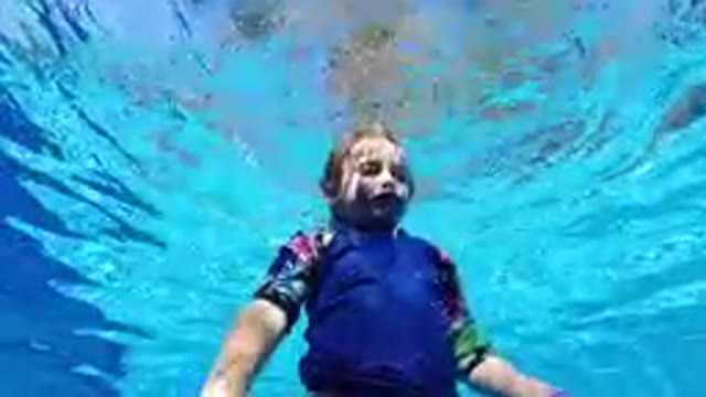 SAN JOSE DEL CABO, MEXICO-2019: Young Child Learning Pool Safety