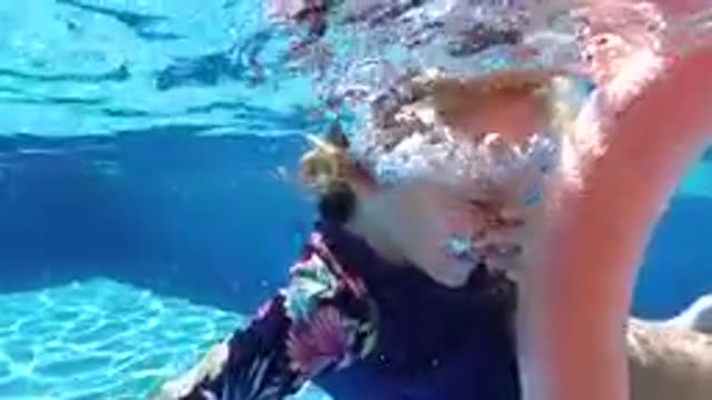 CABO BAJA CALIFORNIA SUR MEXICO-2019: Child Swimming Underwater With Pool Noodle