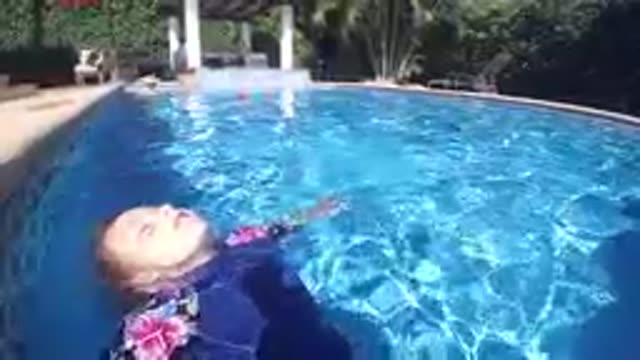 CABO BAJA CALIFORNIA SUR MEXICO-2019: Woman Floating Relaxed In Tropical Pool