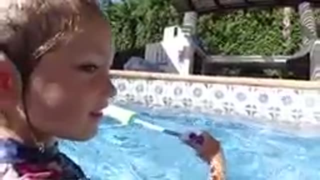 CABO BAJA CALIFORNIA SUR MEXICO-2019: Young Girl Swimming In Outdoor Pool