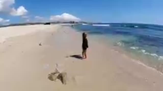 CABO BAJA CALIFORNIA SUR MEXICO-2019: Child Playing In Ocean Waves On Beach