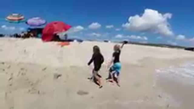 Los Cabos, Mexico-2019: Kids Returning to their Resort Umbrellas