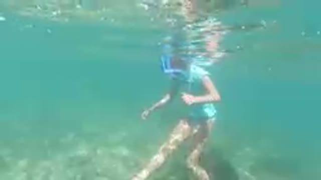 LOS CABOS, MEXICO-2019: Beautiful Mom Snorkeling in Tropical Waters