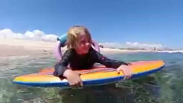 Los Cabos, Mexico-2019: Little Girl Smiles Brightly While Floating on the Sea