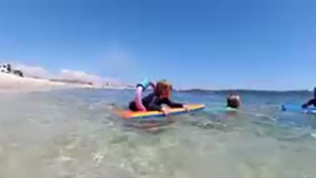 Los Cabos, Mexico-2019: Brave Cute Kids Floating on the Sea