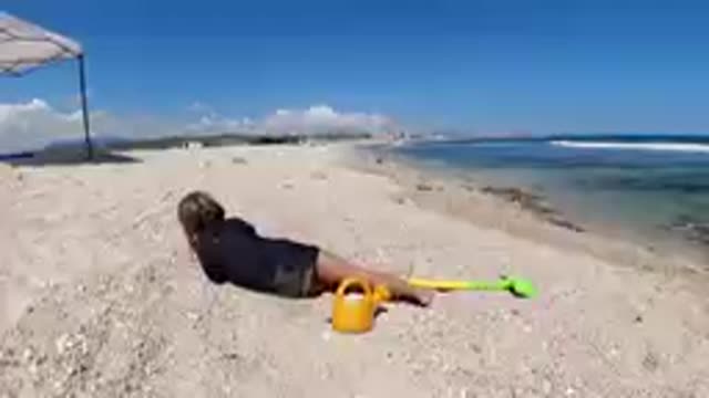 CABO BAJA CALIFORNIA SUR MEXICO-2019: Child Playing With Sand Toys On Beach