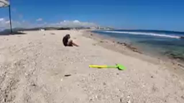 CABO BAJA CALIFORNIA SUR MEXICO-2019: Person Sitting On Beach With Toy Shovel