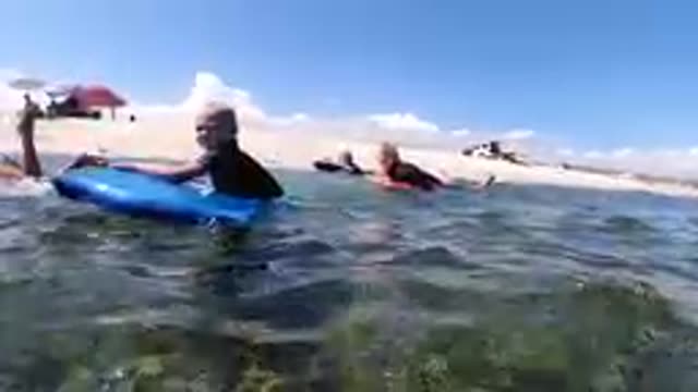CABO BAJA CALIFORNIA SUR MEXICO-2019: Children Learning To Surf On Blue Boogie Board