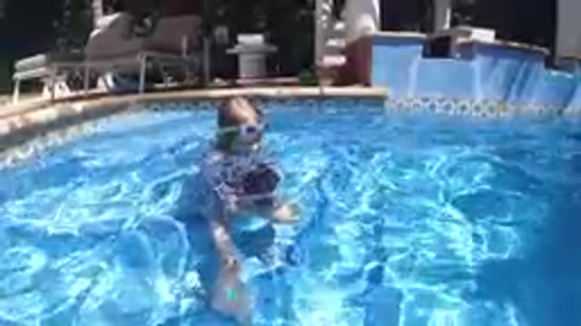 CABO BAJA CALIFORNIA SUR MEXICO-2019: Young Boy Swimming In Backyard Pool