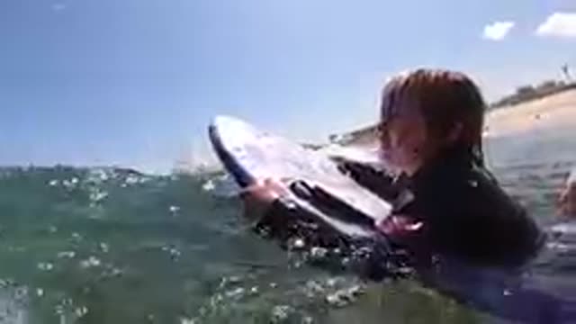 CABO BAJA CALIFORNIA SUR MEXICO-2019: Surfer Paddling Out On Board