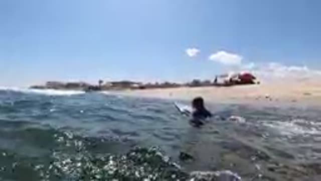 CABO BAJA CALIFORNIA SUR MEXICO-2019: Surfer Paddling Out On Blue Ocean Waves