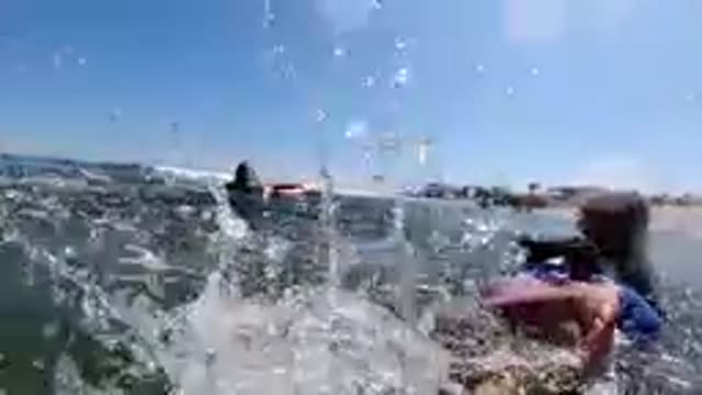 CABO BAJA CALIFORNIA SUR MEXICO-2019: Children Paddling Bodyboards In Ocean Waves