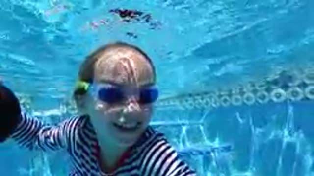 CABO BAJA CALIFORNIA SUR MEXICO-2019: Young Girl Swimming Underwater In Pool