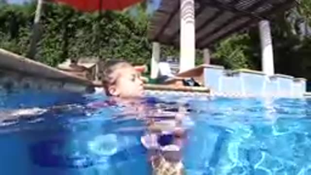 CABO BAJA CALIFORNIA SUR MEXICO-2019: Young Girl Swimming In Resort Pool