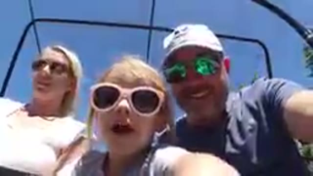 Family Taking Selfie On A Ski Lift With A Child