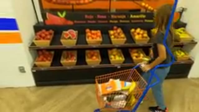 MEXICO CITY MEXICO- Aug. 30, 2023: Young Girl Pushing A Shopping Cart In A Store
