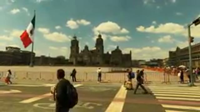 MEXICO CITY MEXICO-2023: People Walking by Historic Government Building