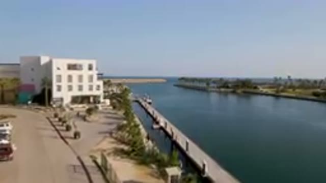 PUERTO LOS CABOS BCS MEXICO-2023: Large Body Of Water With A Dock In The Middle