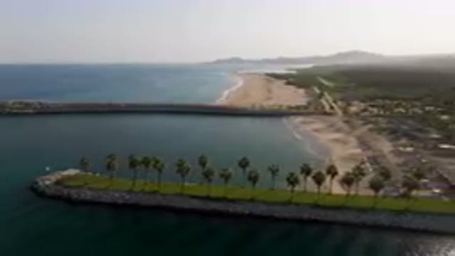 PUERTO LOS CABOS BCS MEXICO-2023: Aerial Beach And A Pier With Palm Trees
