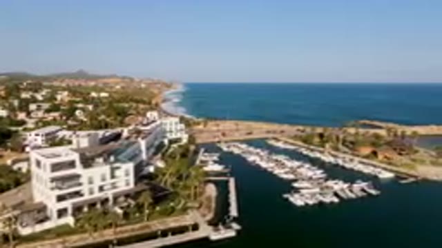 PUERTO LOS CABOS BCS MEXICO-2023: Boats Are Docked In A Harbor Near A City By