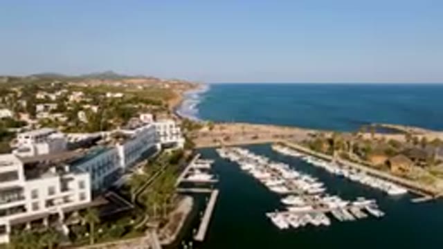 PUERTO LOS CABOS BCS MEXICO-2023: Boats Docked in Harbor Near City by Ocean