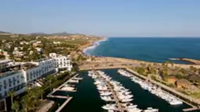 PUERTO LOS CABOS BCS MEXICO-2023: Boats Docked in Marina Near Beach