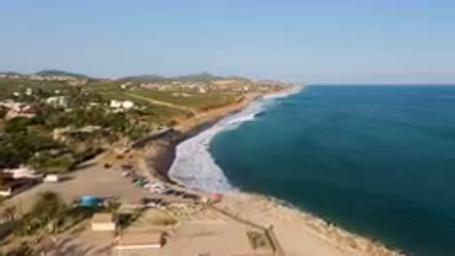 PUERTO LOS CABOS BCS MEXICO-2023: Beach With A Lot Of People And A Body Of Water