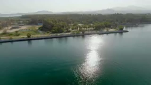 PUERTO LOS CABOS BCS MEXICO-2023: Large Body Of Water With A Small Island In The Middle