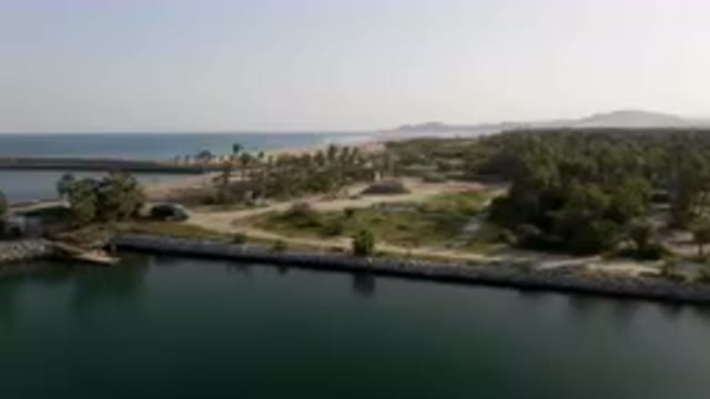 PUERTO LOS CABOS BCS MEXICO-2023: Large Body Of Water With A Small Island In The