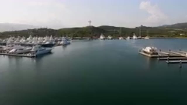 PUERTO LOS CABOS BCS MEXICO-2023: Boats Docked At A Marina With Mountains In The Background
