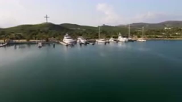 PUERTO LOS CABOS BCS MEXICO-2023: Many Boats Docked In The Water Near A Mountain