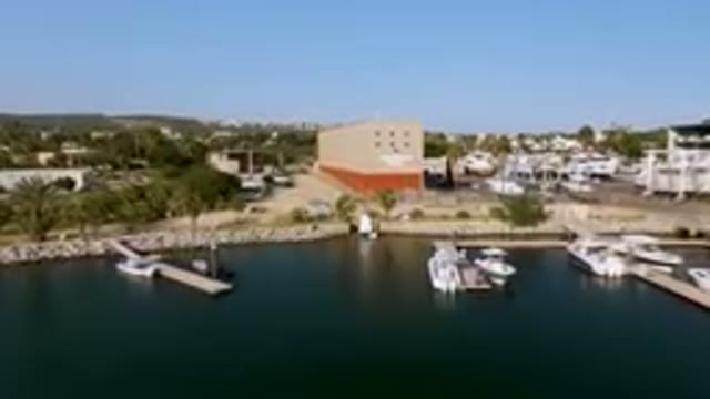 PUERTO LOS CABOS BCS MEXICO-2023: Boats Docked At A Marina In A City With A