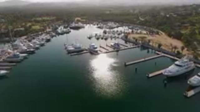 PUERTO LOS CABOS BCS MEXICO-2023: Marina With Boats Docked And Mountains In The