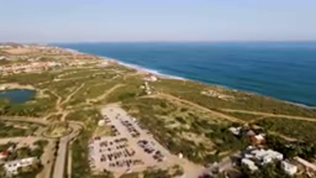 PUERTO LOS CABOS BCS MEXICO-2023: Aerial Beach With A Lot Of Cars Parked In The