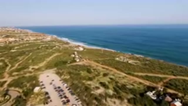 PUERTO LOS CABOS BCS MEXICO-2023: Aerial Beach With A Lot Of Cars Parked On The Sand