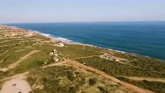 PUERTO LOS CABOS BCS MEXICO-2023: Aerial Beach And A Town With A Lighthouse