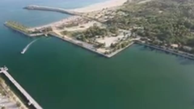 PUERTO LOS CABOS BCS MEXICO-2023: Aerial Large Body Of Water With A Pier And A