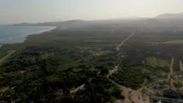 PUERTO LOS CABOS BCS MEXICO-2023: Aerial City And Beach With A Plane Flying