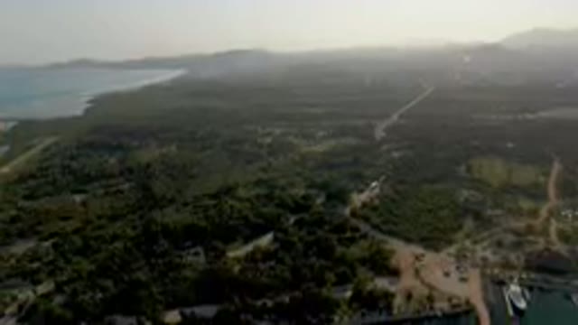 PUERTO LOS CABOS BCS MEXICO-2023: Aerial Small Island With A Marina And A Boat