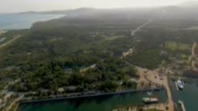 PUERTO LOS CABOS BCS MEXICO-2023: Aerial Small Island With A Marina And A Boat