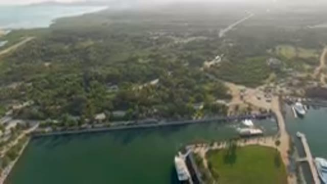 PUERTO LOS CABOS BCS MEXICO-2023: Aerial River And A City With A Bridge