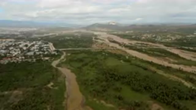 SAN JOSE DEL CABO BCS MEXICO-2023: Aerial River Running Through A Lush Green Valley