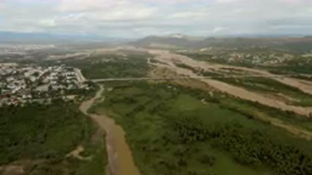 SAN JOSE DEL CABO BCS MEXICO-2023: Aerial River Running Through A Lush Green Valley